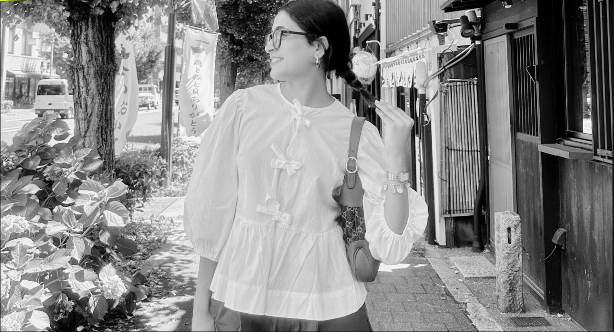 Renee Mundra walking down a street in Kyoto