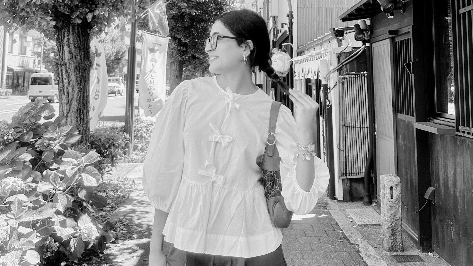 Renee Mundra walking down a street in Kyoto